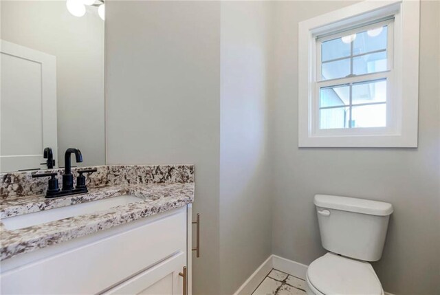 3217 SW Saddlebred Ter, Lees Summit, MO 64082 - half bathroom featuring toilet, vanity, and baseboards