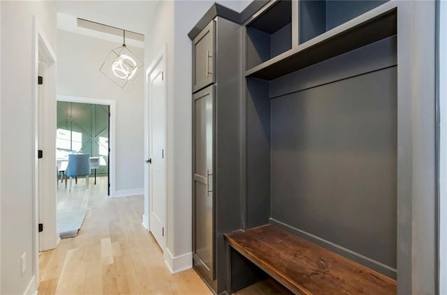 3217 SW Saddlebred Ter, Lees Summit, MO 64082 - mudroom with light wood-style floors and baseboards