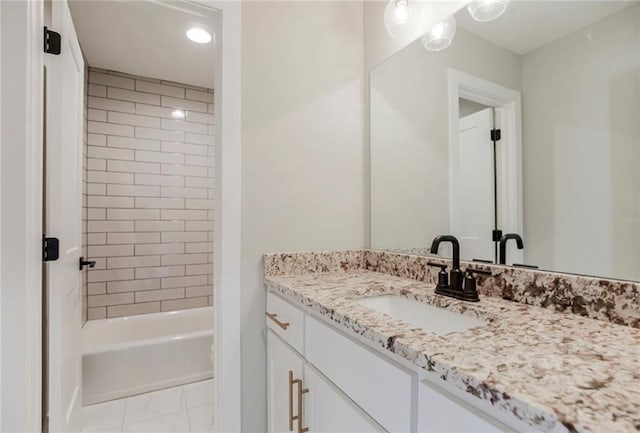3217 SW Saddlebred Ter, Lees Summit, MO 64082 - bathroom featuring vanity, marble look tile flooring, bathing tub / shower combination, and recessed lighting