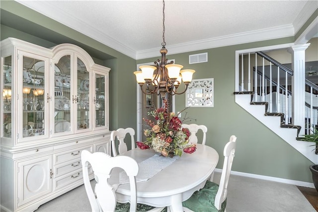 carpeted dining room with ornamental molding, visible vents, baseboards, and a notable chandelier
