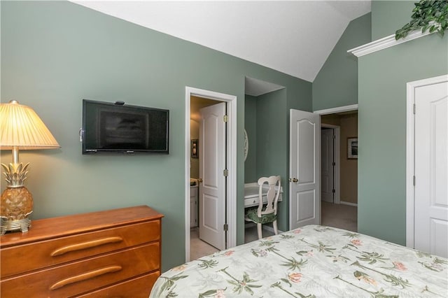 carpeted bedroom with vaulted ceiling