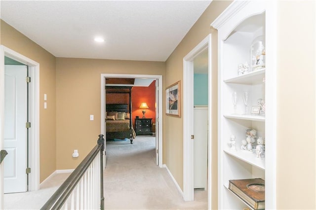 corridor featuring recessed lighting and light carpet