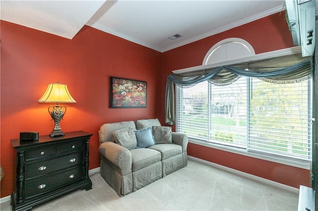living area featuring visible vents, baseboards, ornamental molding, and carpet