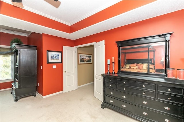 bedroom with light colored carpet, baseboards, and ornamental molding
