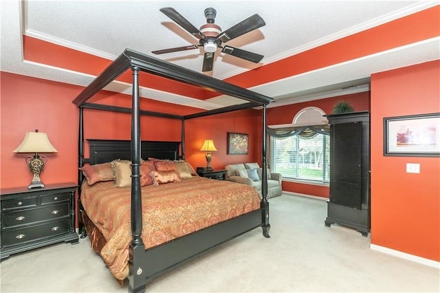 bedroom with baseboards, crown molding, a ceiling fan, and carpet floors