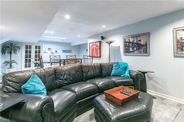 living room featuring french doors, wood finished floors, baseboards, and recessed lighting
