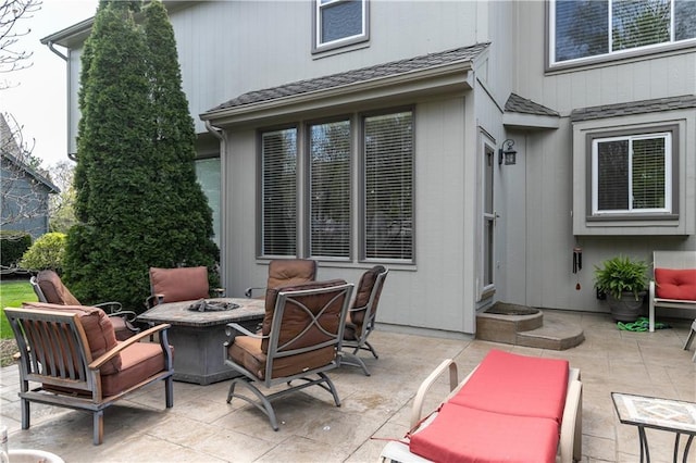view of patio / terrace with an outdoor fire pit