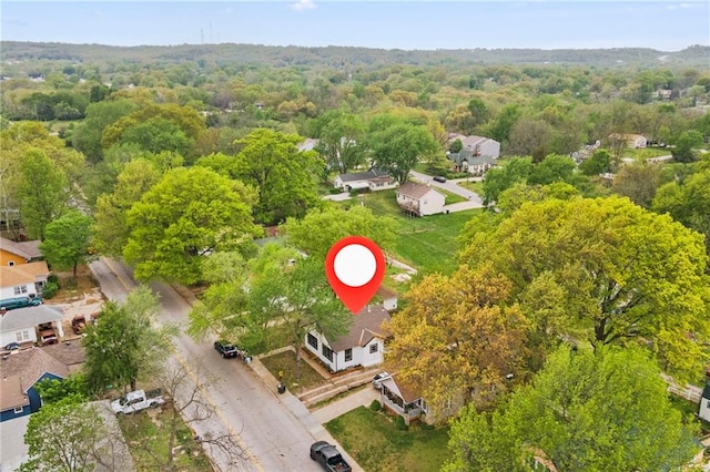 aerial view featuring a residential view and a forest view
