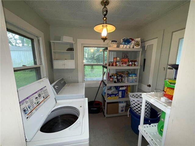 110 W Mechanic Ave, Independence, MO 64050 - laundry area with independent washer and dryer and healthy amount of natural light