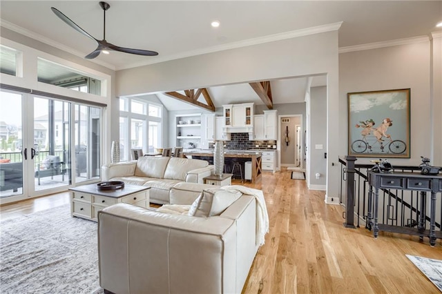 7530 N Gower Ave, Kansas City, MO 64151 - living room featuring light wood-style floors, a ceiling fan, recessed lighting, vaulted ceiling with beams, and baseboards