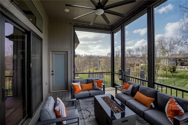 7530 N Gower Ave, Kansas City, MO 64151 - sunroom featuring a healthy amount of sunlight, an outdoor living space with a fire pit, and ceiling fan