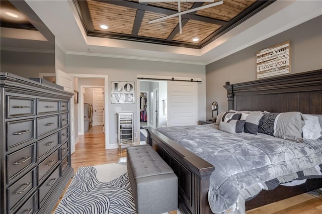 7530 N Gower Ave, Kansas City, MO 64151 - bedroom with baseboards, light wood-type flooring, crown molding, a barn door, and a tray ceiling