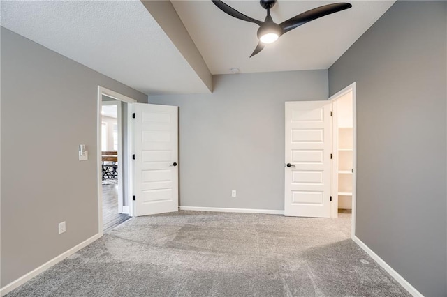 7530 N Gower Ave, Kansas City, MO 64151 - unfurnished bedroom with ceiling fan, carpet flooring, and baseboards