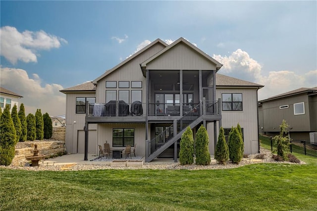 7530 N Gower Ave, Kansas City, MO 64151 - back of house featuring a patio area, a sunroom, stairs, a yard, and fence