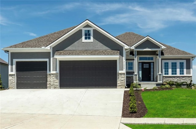 3222 SW Enoch St, Lees Summit, MO 64082 - craftsman inspired home with an attached garage, stone siding, concrete driveway, a front lawn, and stucco siding