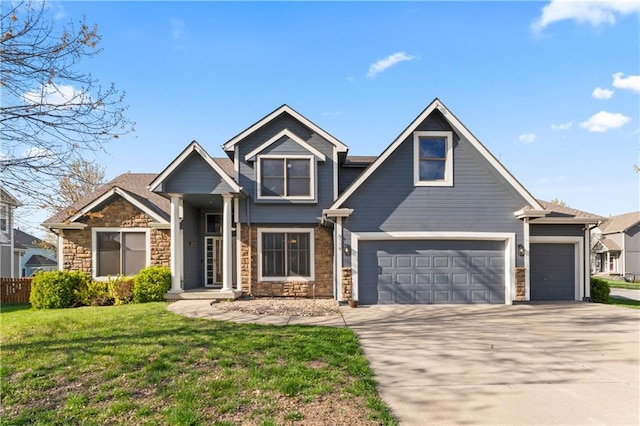 8110 NE 72nd Ter, Kansas City, MO 64158 - craftsman-style house featuring concrete driveway, fence, stone siding, and a front lawn