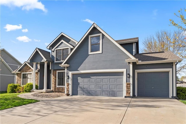 8110 NE 72nd Ter, Kansas City, MO 64158 - craftsman house featuring a garage, stone siding, and concrete driveway