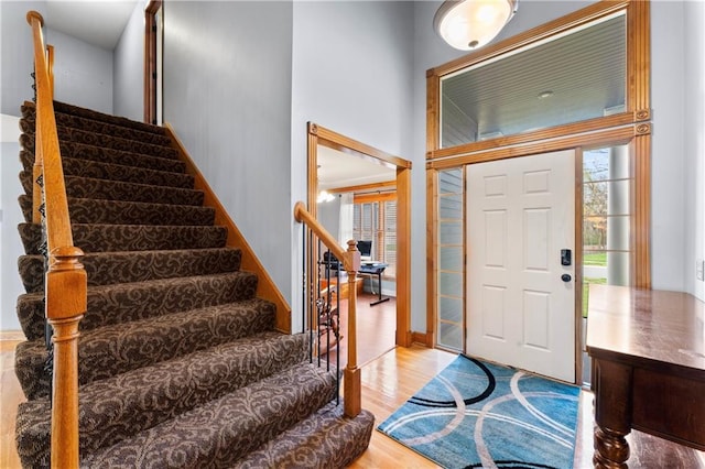8110 NE 72nd Ter, Kansas City, MO 64158 - foyer entrance featuring wood finished floors, plenty of natural light, and stairs