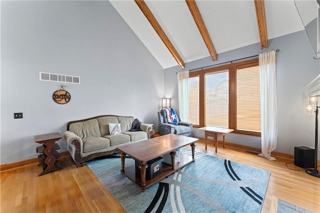 8110 NE 72nd Ter, Kansas City, MO 64158 - living area with baseboards, high vaulted ceiling, beam ceiling, and visible vents