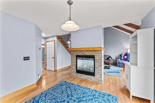 8110 NE 72nd Ter, Kansas City, MO 64158 - living room featuring baseboards, a multi sided fireplace, light wood-type flooring, recessed lighting, and vaulted ceiling