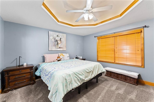 8110 NE 72nd Ter, Kansas City, MO 64158 - carpeted bedroom with baseboards, a raised ceiling, and a ceiling fan