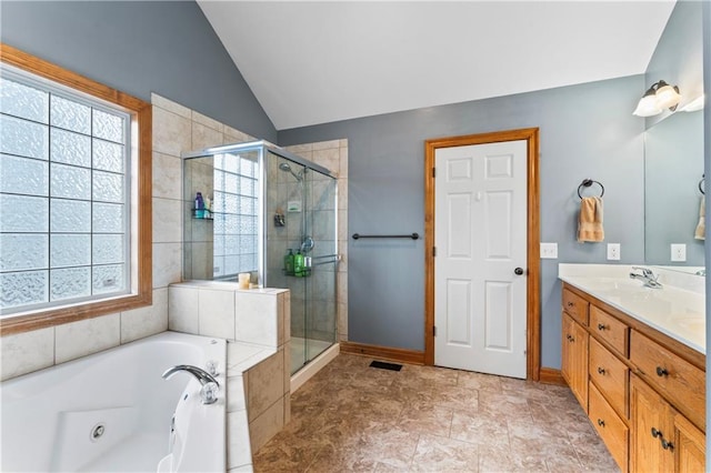 8110 NE 72nd Ter, Kansas City, MO 64158 - bathroom featuring a sink, a shower stall, plenty of natural light, and lofted ceiling
