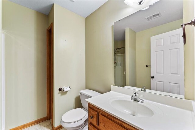 8110 NE 72nd Ter, Kansas City, MO 64158 - full bathroom featuring visible vents, toilet, a shower, and vanity
