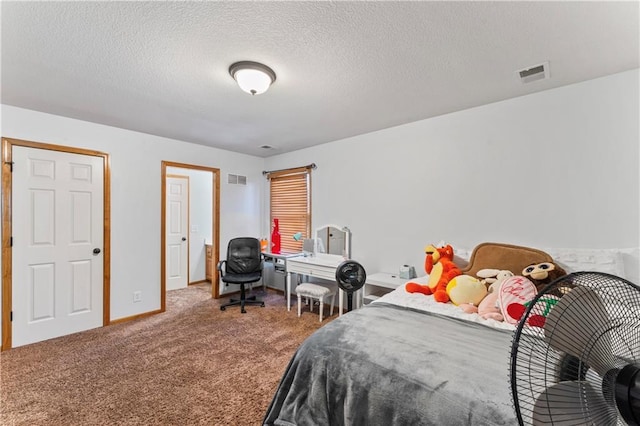8110 NE 72nd Ter, Kansas City, MO 64158 - bedroom featuring carpet flooring, visible vents, a textured ceiling, and baseboards