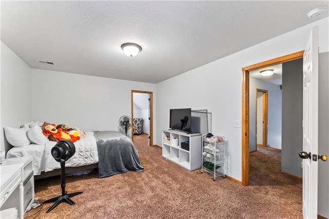 8110 NE 72nd Ter, Kansas City, MO 64158 - bedroom with visible vents, carpet, and a textured ceiling