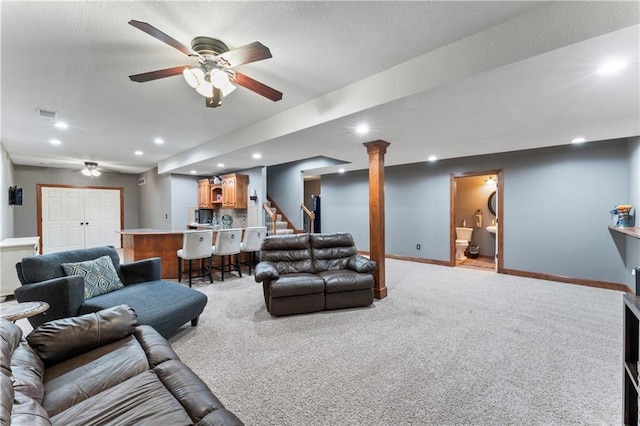 8110 NE 72nd Ter, Kansas City, MO 64158 - living area with indoor bar, ceiling fan, light carpet, and baseboards