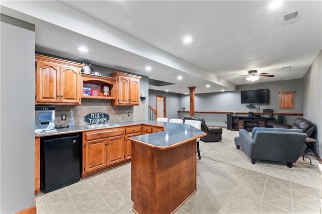 8110 NE 72nd Ter, Kansas City, MO 64158 - kitchen with refrigerator, recessed lighting, open shelves, ceiling fan, and decorative backsplash