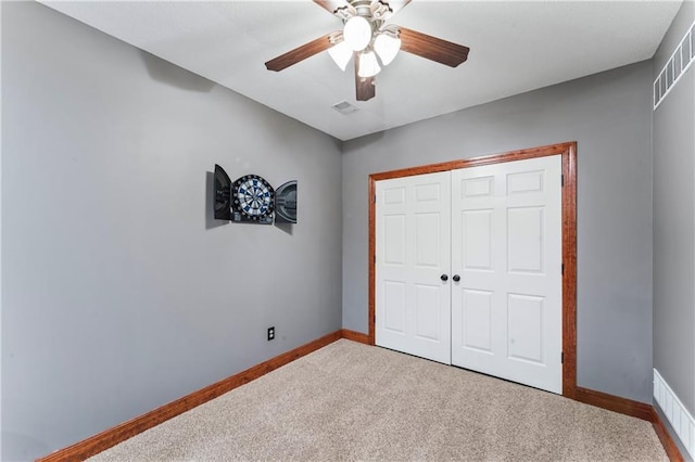 8110 NE 72nd Ter, Kansas City, MO 64158 - unfurnished bedroom with a closet, a ceiling fan, visible vents, carpet floors, and baseboards