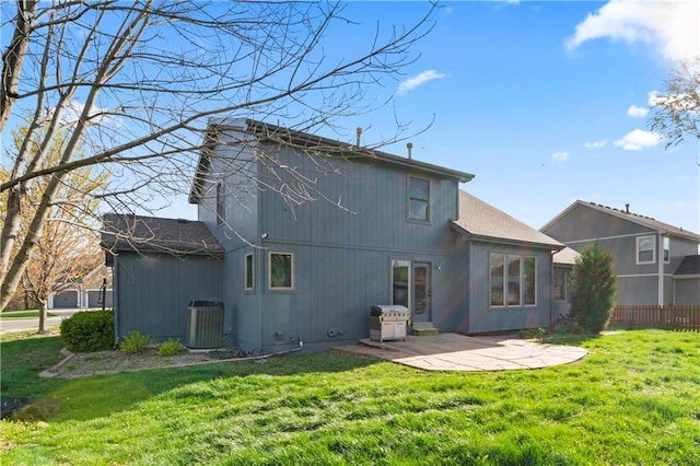 8110 NE 72nd Ter, Kansas City, MO 64158 - rear view of house featuring a patio area, fence, central AC unit, and a lawn
