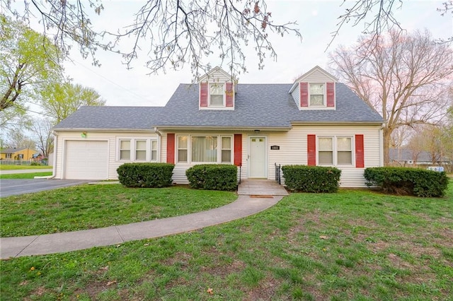 1601 S Market St, Holden, MO 64040 - cape cod house with a front yard, roof with shingles, driveway, and an attached garage