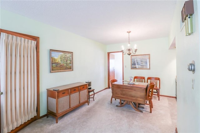 1601 S Market St, Holden, MO 64040 - dining space featuring baseboards, an inviting chandelier, and light carpet