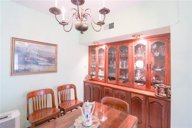 1601 S Market St, Holden, MO 64040 - dining area with visible vents and a chandelier