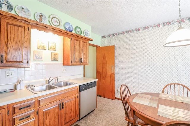 1601 S Market St, Holden, MO 64040 - kitchen featuring a sink, light countertops, stainless steel dishwasher, and a textured ceiling