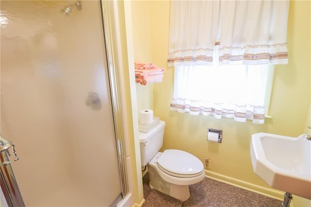 1601 S Market St, Holden, MO 64040 - full bathroom with a sink, toilet, a shower stall, and baseboards
