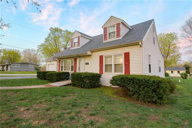 1601 S Market St, Holden, MO 64040 - cape cod home featuring a front yard, an attached garage, and a shingled roof