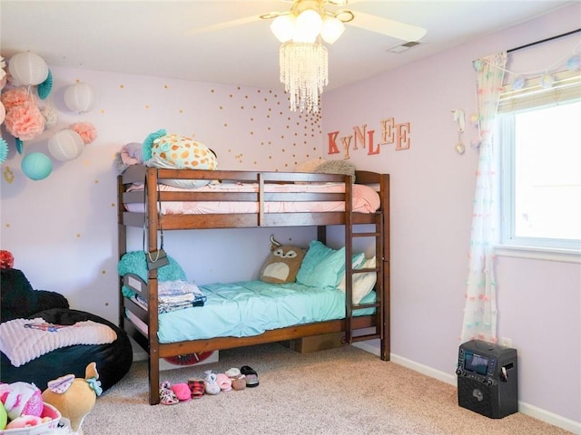 carpeted bedroom with visible vents and baseboards