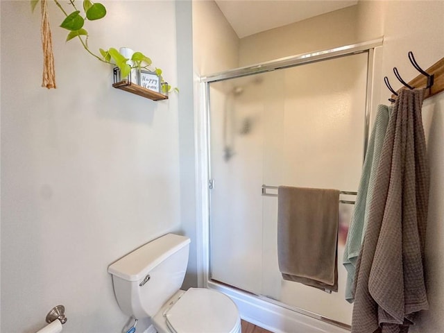 full bath with a shower stall and toilet