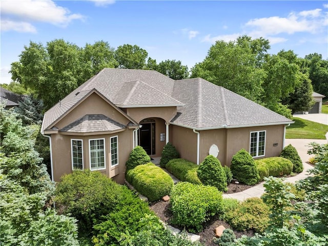22912 W 47th Ter, Shawnee, KS 66226 - view of front facade featuring stucco siding and roof with shingles