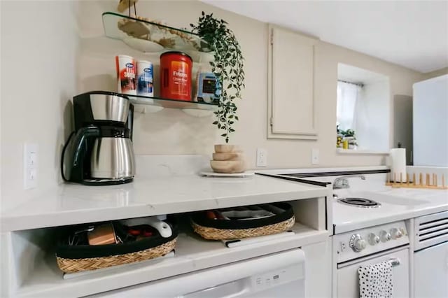 kitchen with light countertops and white cabinets