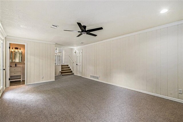 11715 E 60th St, Kansas City, MO 64133 - carpeted spare room with a ceiling fan, stairway, ornamental molding, and visible vents