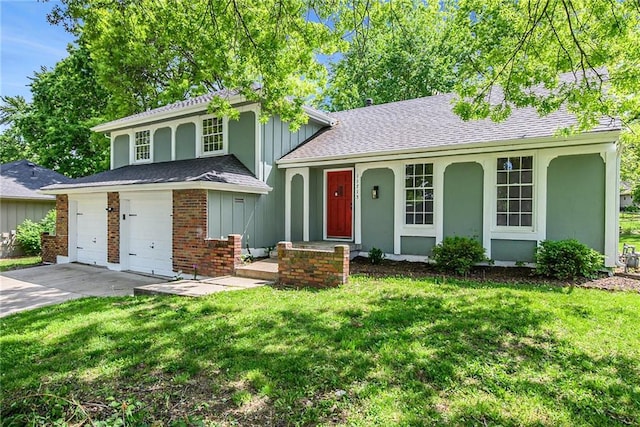 11715 E 60th St, Kansas City, MO 64133 - split level home featuring driveway, a shingled roof, a front lawn, and a garage