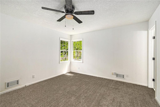 11715 E 60th St, Kansas City, MO 64133 - spare room with a ceiling fan, dark carpet, visible vents, and a textured ceiling