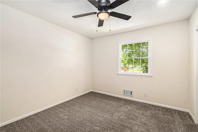 11715 E 60th St, Kansas City, MO 64133 - unfurnished room with baseboards, ceiling fan, dark colored carpet, and visible vents