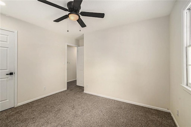 11715 E 60th St, Kansas City, MO 64133 - unfurnished bedroom with ceiling fan, carpet, and baseboards