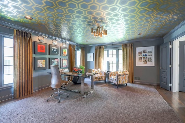 office area with visible vents, ornamental molding, wood finished floors, baseboards, and an ornate ceiling