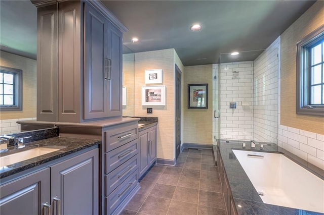 full bath with tile patterned flooring, vanity, a tub, recessed lighting, and a shower stall